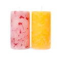Two color wax candles on white Royalty Free Stock Photo