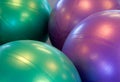 Two colored exercise balls with their reflections Royalty Free Stock Photo