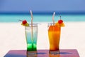 Two colorful cocktails on the beach Royalty Free Stock Photo