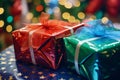 two colorful gift boxes sitting on a table in front of a christmas tree Royalty Free Stock Photo