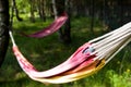 Two colorful hammocks in garden