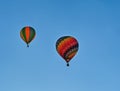 Two colorful hot air balloons flying through the sky Royalty Free Stock Photo