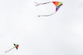 Two colorful kites fly in the sky Royalty Free Stock Photo