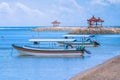 Two colorful open wooden boats with roof for tourist trips at small sea bay at Sanur beach in Bali. Sanur, Indonesia Royalty Free Stock Photo