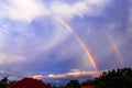 Two colorful rainbow on sky cloud background after rain over home and tree Royalty Free Stock Photo