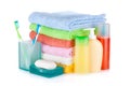 Two colorful toothbrushes, cosmetics bottles, soap and towels Royalty Free Stock Photo