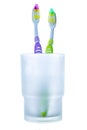 Two colorful toothbrushes in glass Royalty Free Stock Photo