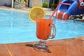 Two Colorful Tropical Cocktails near the Swimming Pool on the Background of Warm Blue Sea. Exotic Summer Vacation. Royalty Free Stock Photo