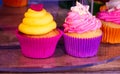 Two colourful cupcakes on street market. Royalty Free Stock Photo