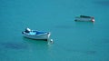 Two Colourful small boats moored in harbour. Royalty Free Stock Photo