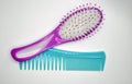 Two combs on a white background, one brush, one comb just a thin Royalty Free Stock Photo