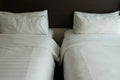 Two comfortable twin beds with contemporary bedding Royalty Free Stock Photo