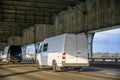 Two compact commercial mini vans running on the two levels bridge Royalty Free Stock Photo