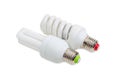 Two compact fluorescent lamp on a light background