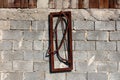 Two completely rusted old hand saws for cutting wood with brown wooden frame mounted as decoration on grey brick wall with metal Royalty Free Stock Photo