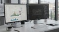 Two computer monitors display data analysis software, with one screen showing bar Royalty Free Stock Photo