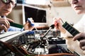 Two Computer Technicians repairing Hardware Royalty Free Stock Photo