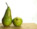 Two conference pears with a white background
