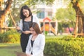 Two confidence business woman working together in a park outd