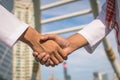 Two confident arab businessman shaking hands. Successful business partners. Negotiating business. Royalty Free Stock Photo