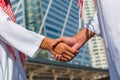 Two confident arab businessman shaking hands. Successful business partners. Negotiating business. Royalty Free Stock Photo