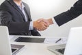 Two confident business man shaking hands during a meeting in the office, success, dealing, greeting and partner concept Royalty Free Stock Photo