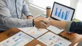 Two confident business man shaking hands during a meeting in the office, success, dealing, greeting and partner concept Royalty Free Stock Photo