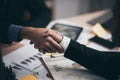 Two confident business man shaking hands during a meeting in the office Royalty Free Stock Photo