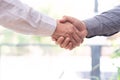 Two confident business man shaking hands during a meeting in the office, success, dealing, greeting and partner concept Royalty Free Stock Photo