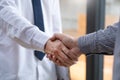 Two confident business man shaking hands during a meeting in the office, success, dealing, greeting and partner concept Royalty Free Stock Photo