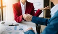 Two confident business man shaking hands during a meeting in the office, success, dealing, greeting and partner Royalty Free Stock Photo