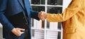 Two confident business man shaking hands during a meeting in the office, success, dealing, greeting and partner Royalty Free Stock Photo