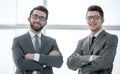 Two confident businessman standing near the office window Royalty Free Stock Photo