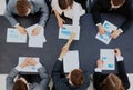 Two confident businessmen handshaking and smiling. top view. Royalty Free Stock Photo