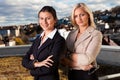 Two confident businesswomen ouside