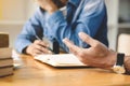 Two confident students doing homework together while sitting at the home or class room, selective focus Royalty Free Stock Photo