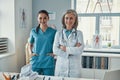 Two confident women coworkers in medical uniform