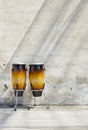 Two congas in front of a vintage wall Royalty Free Stock Photo