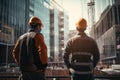 Two construction building men workers in hardhats builders engineers inspect discuss engineering projects looking at