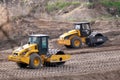 Two Construction Heavy Industrial Machines Working on a Making New Road