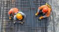 Two Construction Workers Bending Steel Rebar for a Concrete Foundation Royalty Free Stock Photo