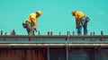 Two Construction Workers on a Bridge Beam Royalty Free Stock Photo