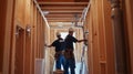 Two Construction Workers in a Partially Built Home Royalty Free Stock Photo