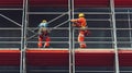 Two Construction Workers on Scaffolding with Safety Gear Royalty Free Stock Photo