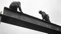 Two Construction Workers On A Steel Beam Royalty Free Stock Photo
