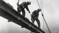 Two Construction Workers on Steel Beam During Bridge Building Royalty Free Stock Photo