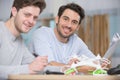 two contented men assembling drone Royalty Free Stock Photo