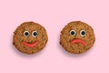 Two cookies with plasticine eyes and lips Royalty Free Stock Photo