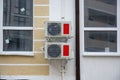 two cooling fans from the air conditioner on the wall of a residential building. Royalty Free Stock Photo