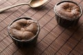 Two coulant cakes on brown bamboo Royalty Free Stock Photo